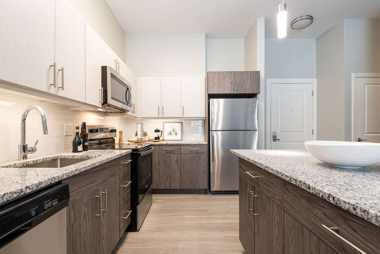 One Wall Street Kitchen with stainless steel dishwasher ranger fridge and granite countertops