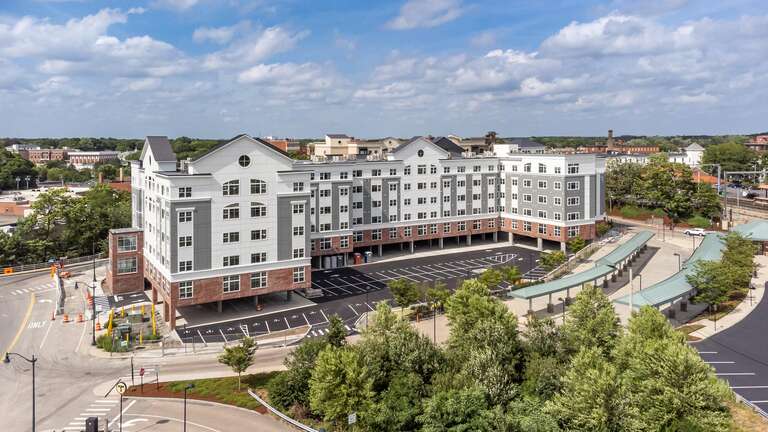 One Wall Street apartments aerial drone photo attleboro with train station